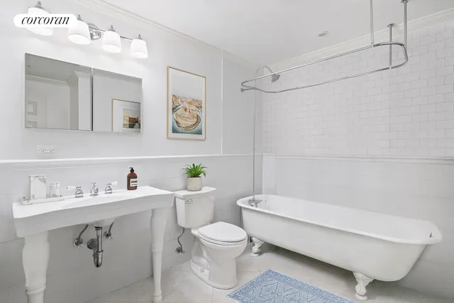 a living room with a book shelf and a book shelf