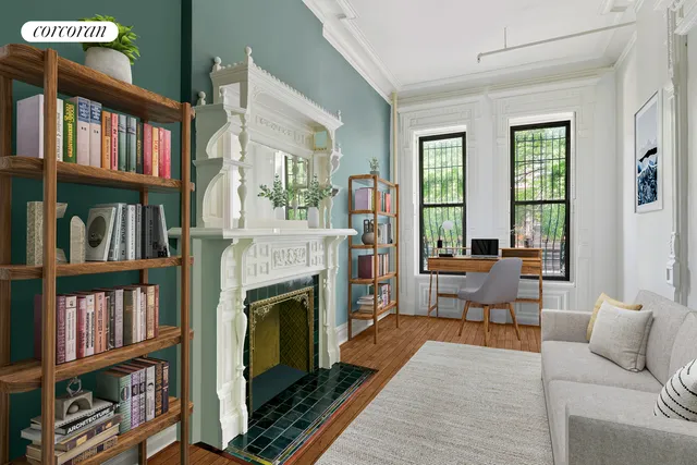 a bedroom with furniture and a book shelf