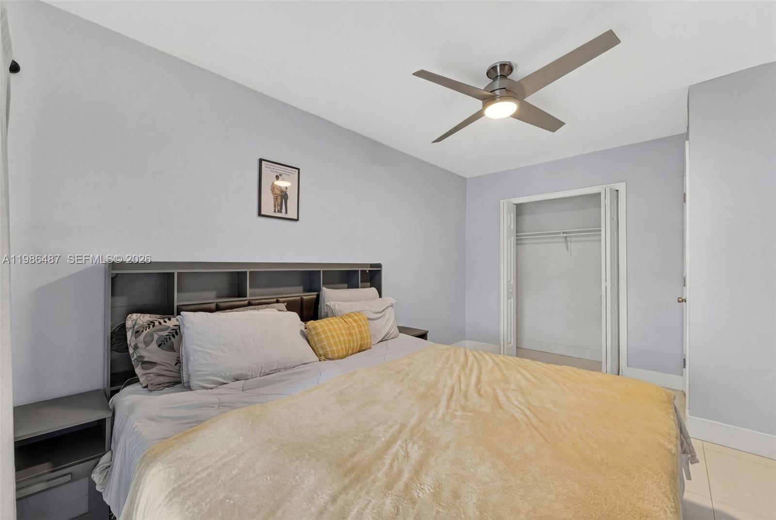 8616 Southwest 103rd Avenue Miami, FL 33173 - Photo 11 of 20 a bedroom with a bed and window