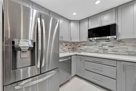 a kitchen with a stove and a microwave