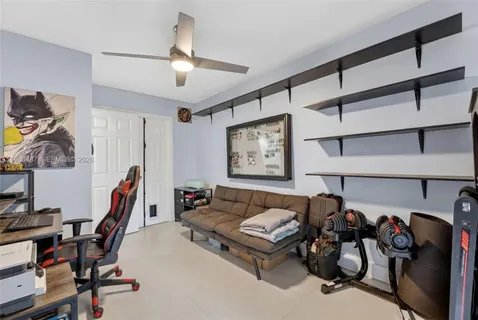 a bedroom with a bed and a television