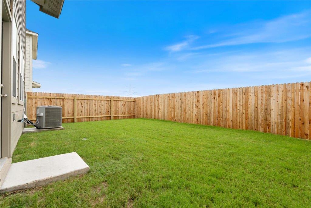 234 Jackson Drive Maxwell, TX 78656 - Photo 13 of 15 a view of a backyard with grass