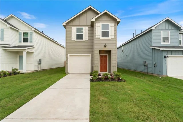 a view of a backyard with grass
