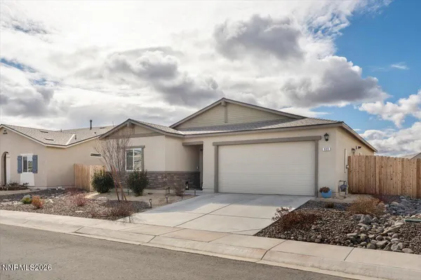 a front view of a house with a garage