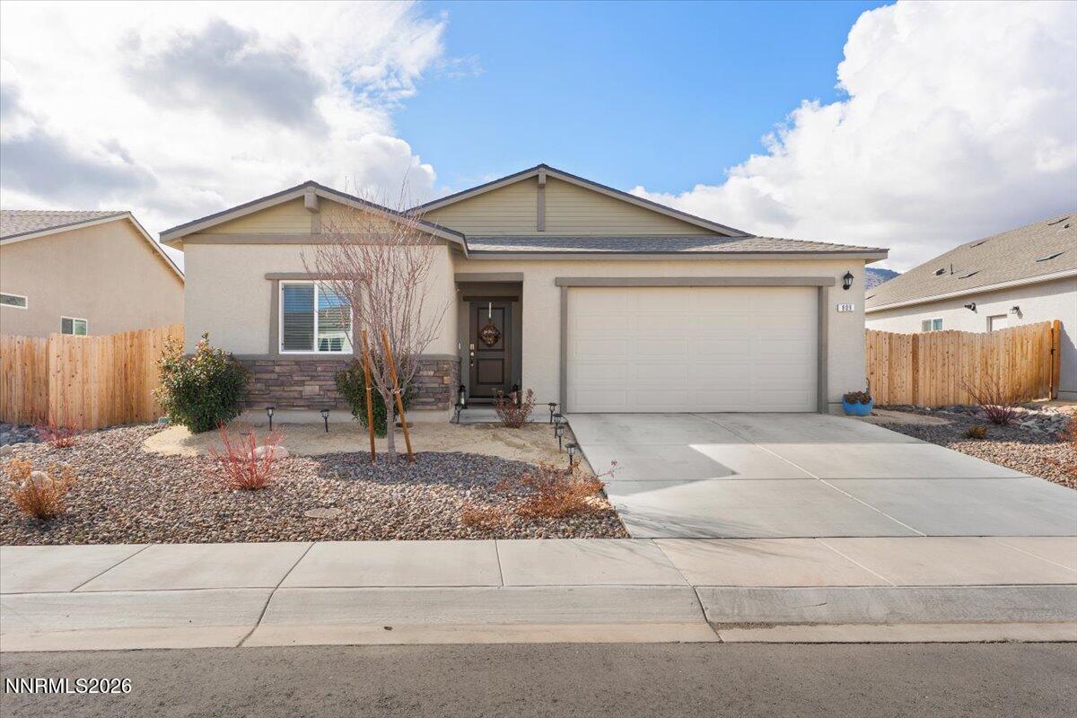 809 Egan Canyon Road Dayton, NV 89403 - Photo 13 of 51 a front view of a house with garage and plants