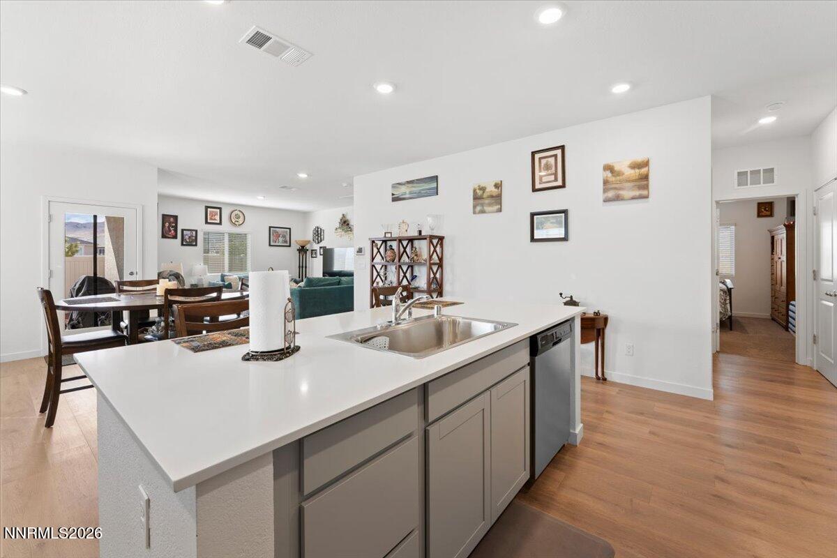 809 Egan Canyon Road Dayton, NV 89403 - Photo 19 of 51 a kitchen with sink refrigerator and cabinets