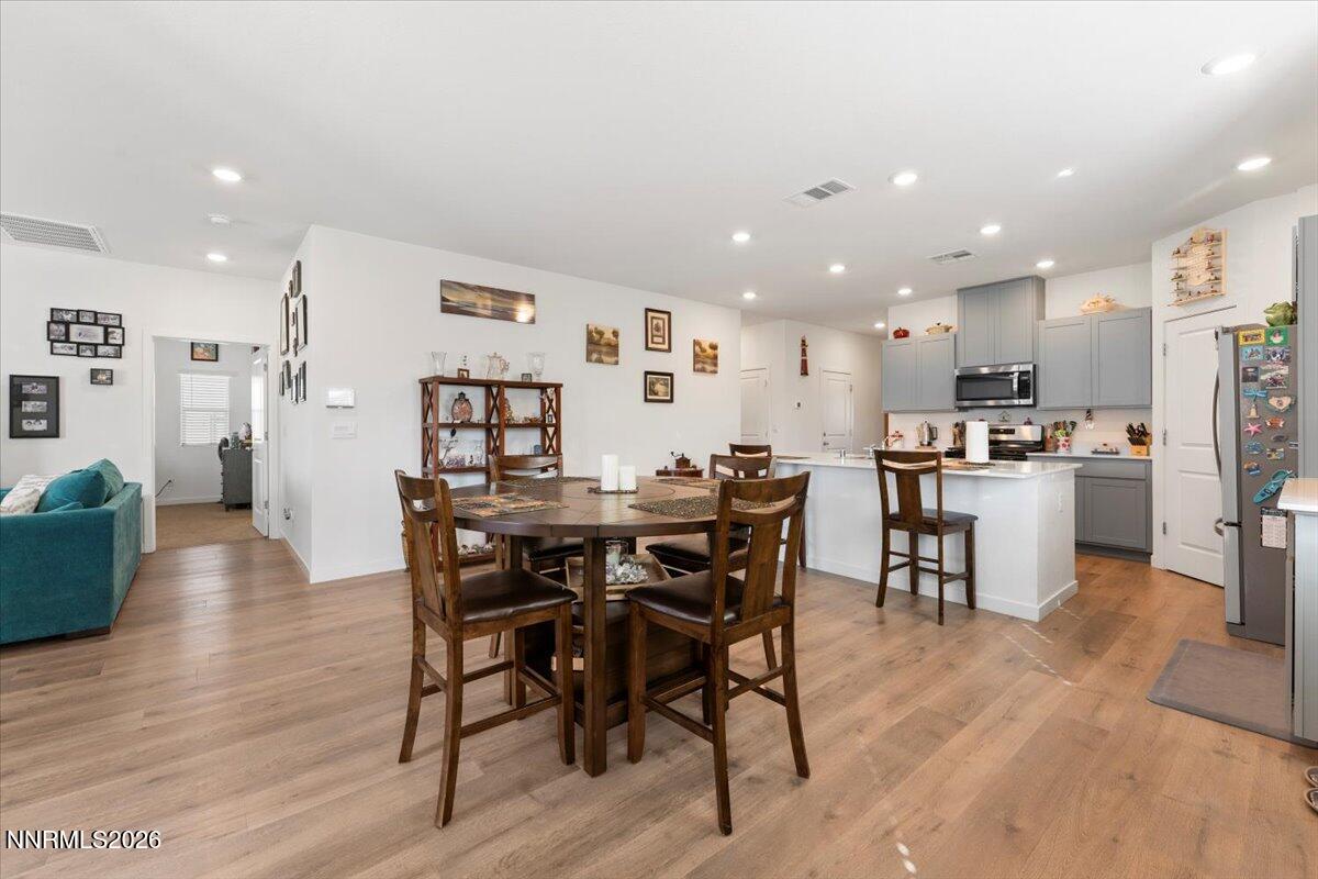 809 Egan Canyon Road Dayton, NV 89403 - Photo 21 of 51 a view of a dining room with furniture and wooden floor