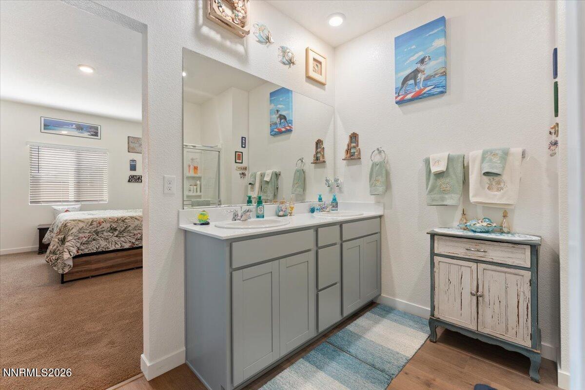 809 Egan Canyon Road Dayton, NV 89403 - Photo 29 of 51 a bathroom with a double vanity sink mirror and bathtub