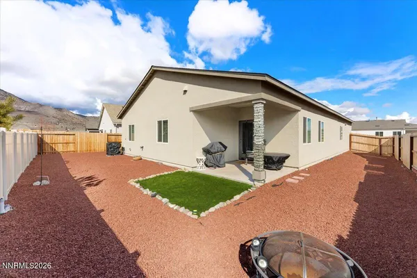 a view of a house with backyard