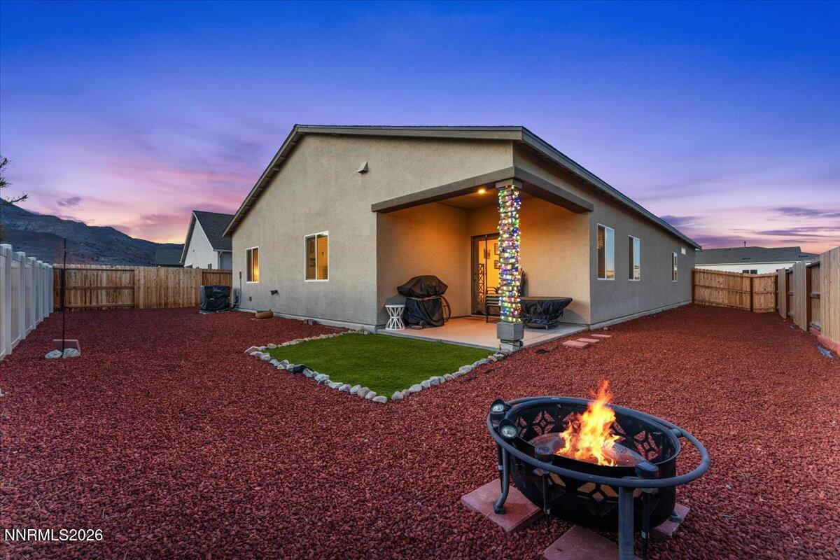 809 Egan Canyon Road Dayton, NV 89403 - Photo 9 of 51 a view of a backyard with a barbeque and a grill