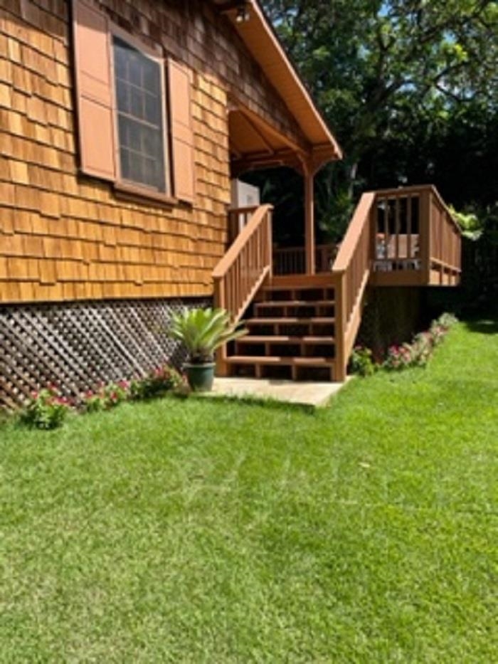 321 West Kuiaha Road Haiku, HI 96708 - Photo 2 of 27 a front view of a house with a yard