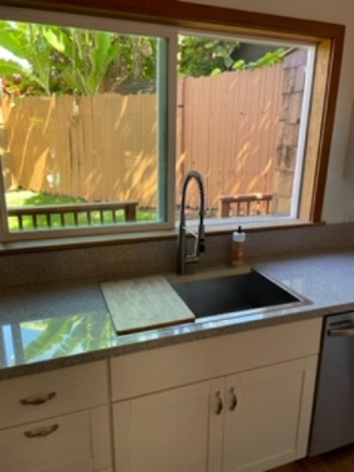 321 West Kuiaha Road Haiku, HI 96708 - Photo 24 of 27 a kitchen with a sink and a large window