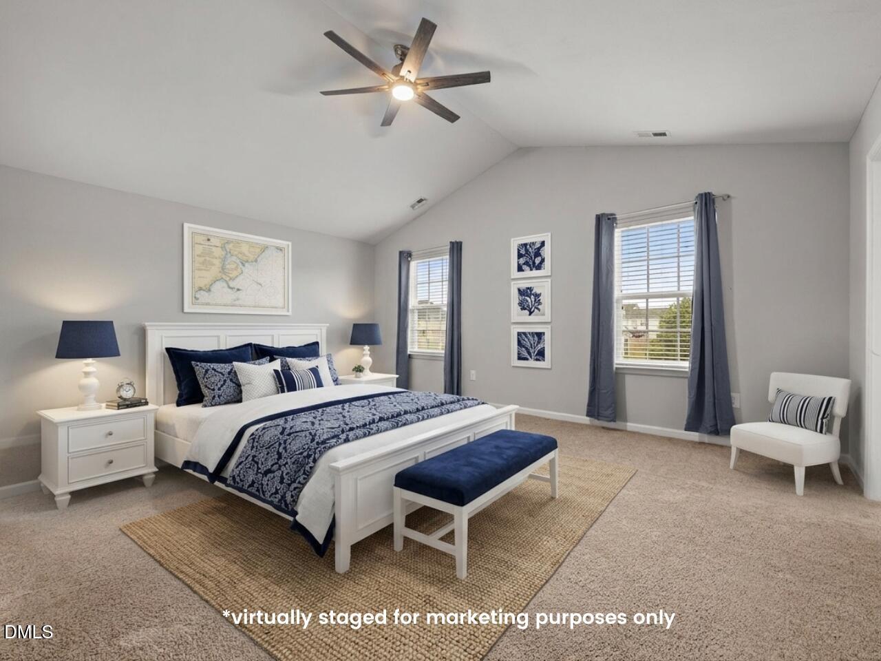45 Crane Way Bunnlevel, NC 28323 - Photo 20 of 35 a spacious bedroom with a bed and a chandelier