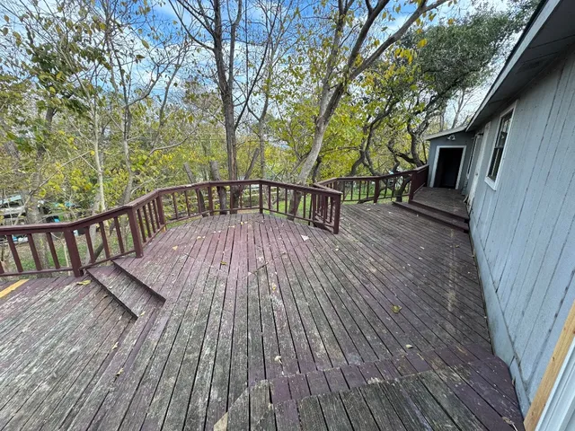 a view of deck with wooden floor and outdoor seating