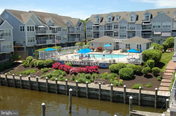 a view of a swimming pool with outdoor seating