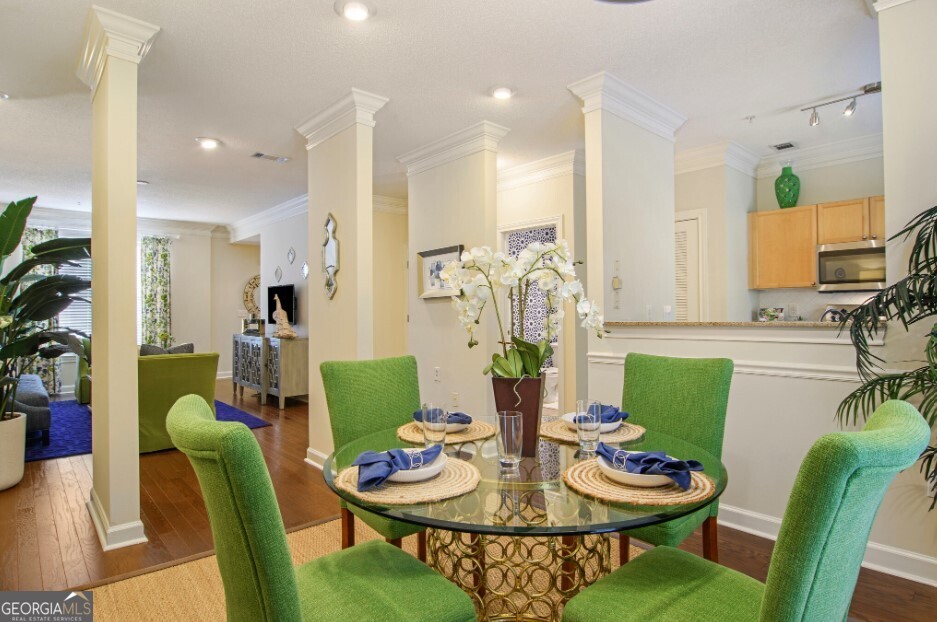 100 Ladson Court, Unit 513 Decatur, GA 30033 - Photo 2 of 20 a view of a dining room with furniture and wooden floor