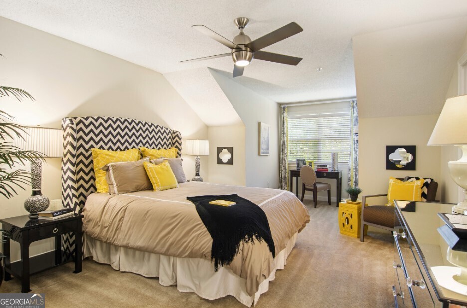 100 Ladson Court, Unit 513 Decatur, GA 30033 - Photo 6 of 20 a bedroom with a bed and wooden floor