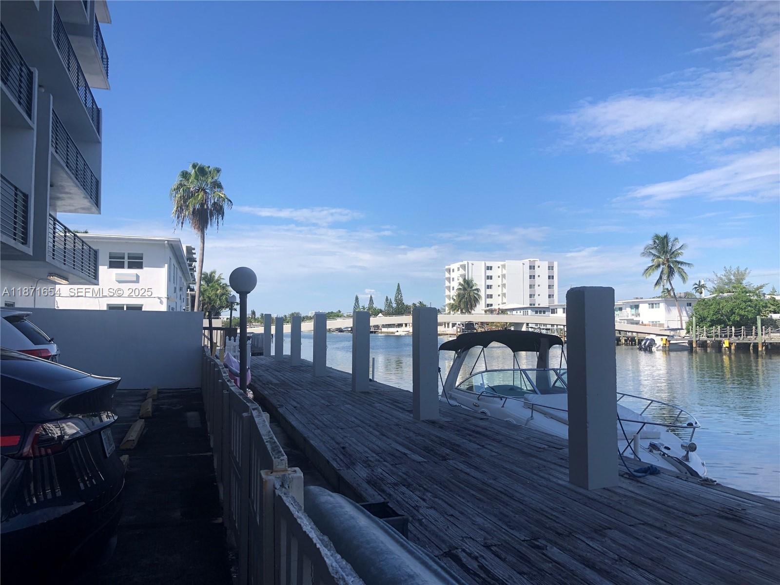 8100 Byron Avenue, Unit 509 Miami Beach, FL 33141 - Photo 15 of 18 a view of a patio with swimming pool