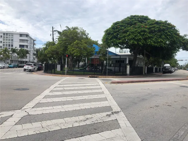 a front view of a building with tree s