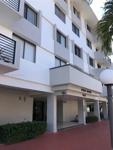 a view of a building with a garage