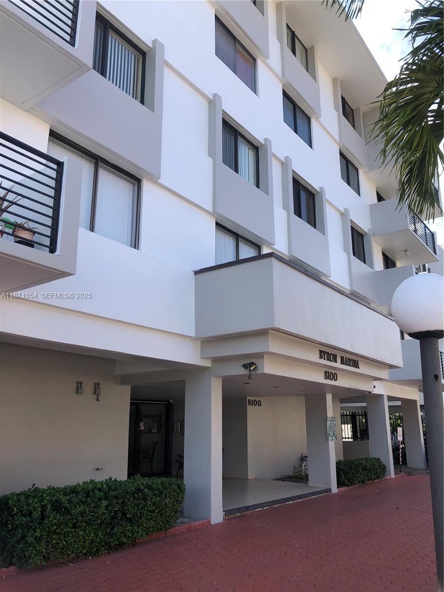 8100 Byron Avenue, Unit 509 Miami Beach, FL 33141 - Photo 2 of 18 a view of a building with a garage