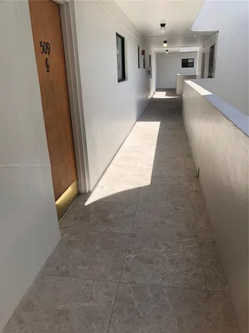 wooden floor with a kitchen