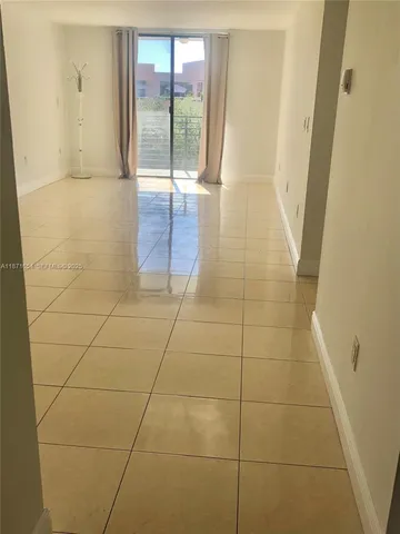 a bathroom with a glass door shower