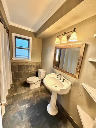a bathroom with a granite countertop sink a mirror and a