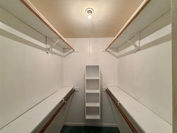 a backyard of a house with barbeque oven table and chairs