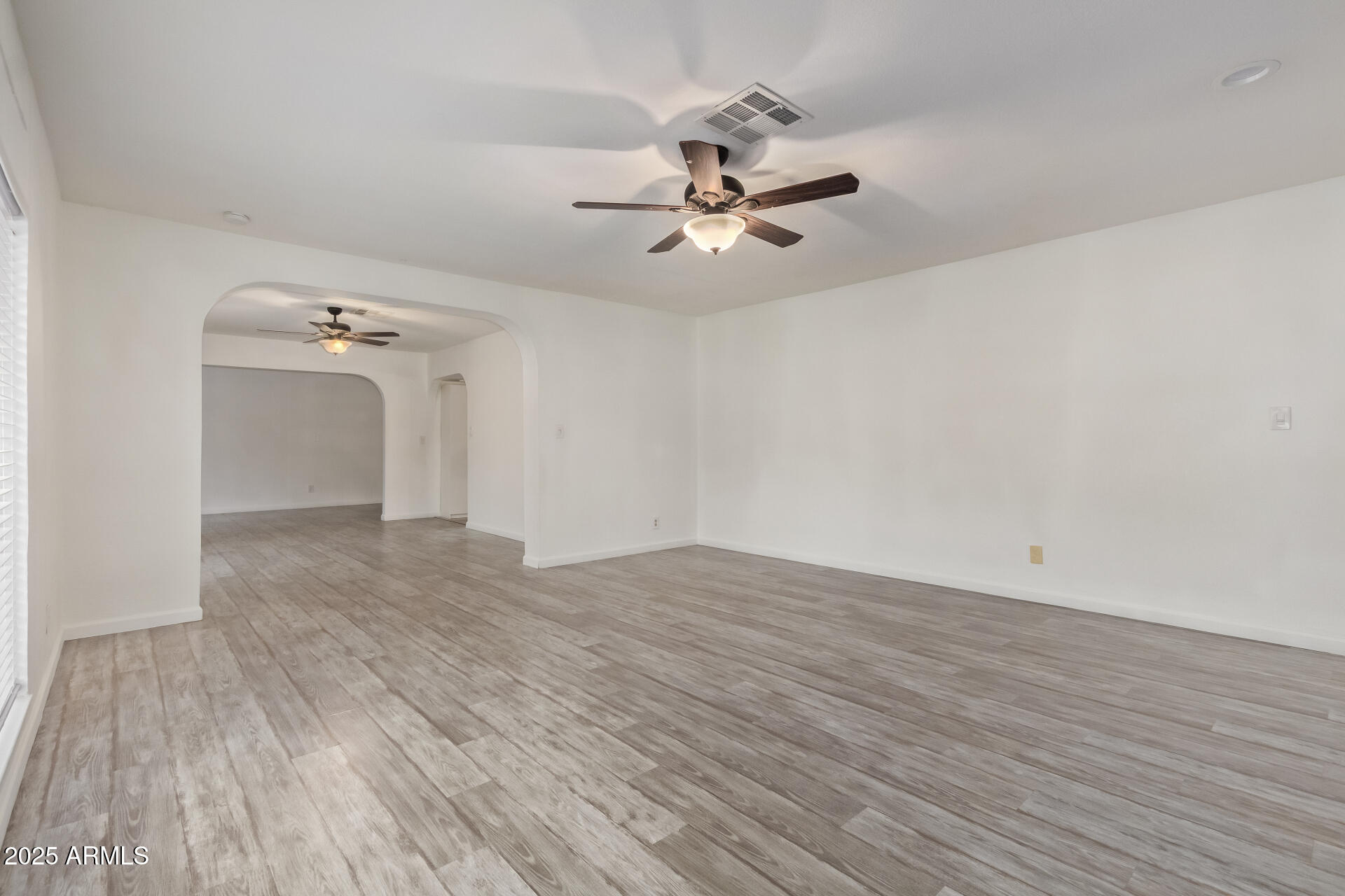 5401 East Exeter Boulevard Phoenix, AZ 85018 - Photo 15 of 47 a view of empty room with wooden floor