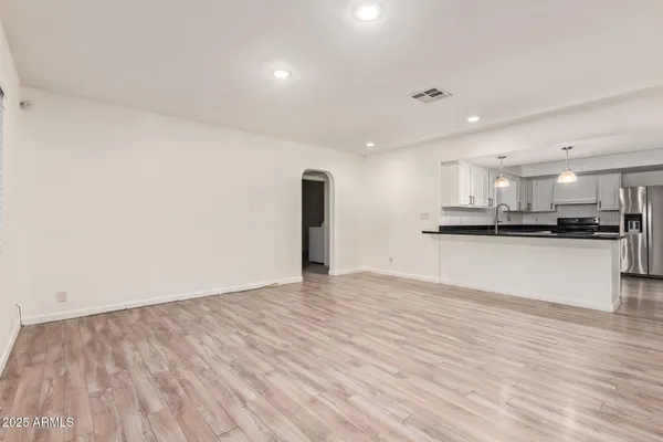 a view of kitchen with wooden floor