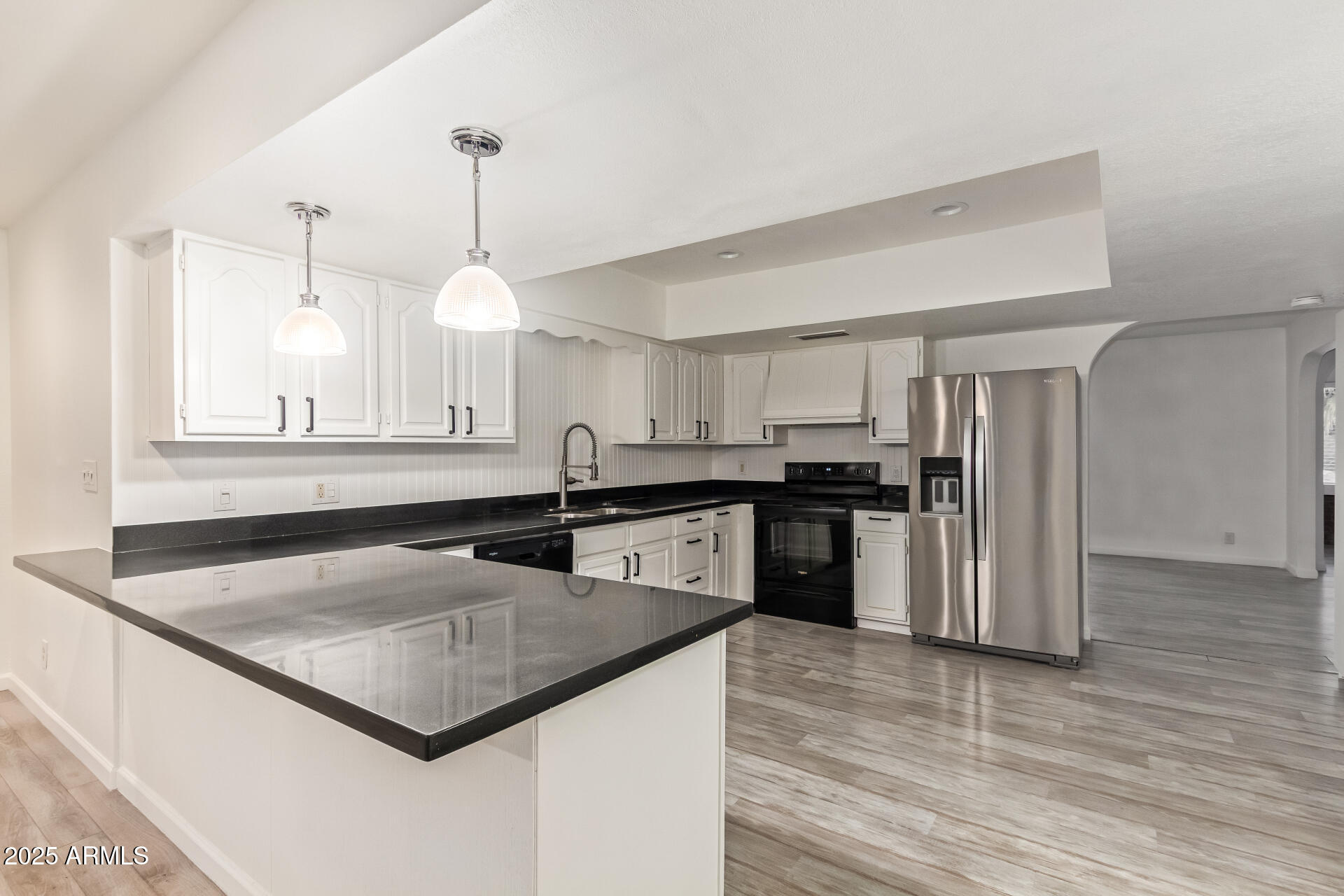 5401 East Exeter Boulevard Phoenix, AZ 85018 - Photo 20 of 47 a kitchen with stainless steel appliances granite countertop a sink a stove and a refrigerator