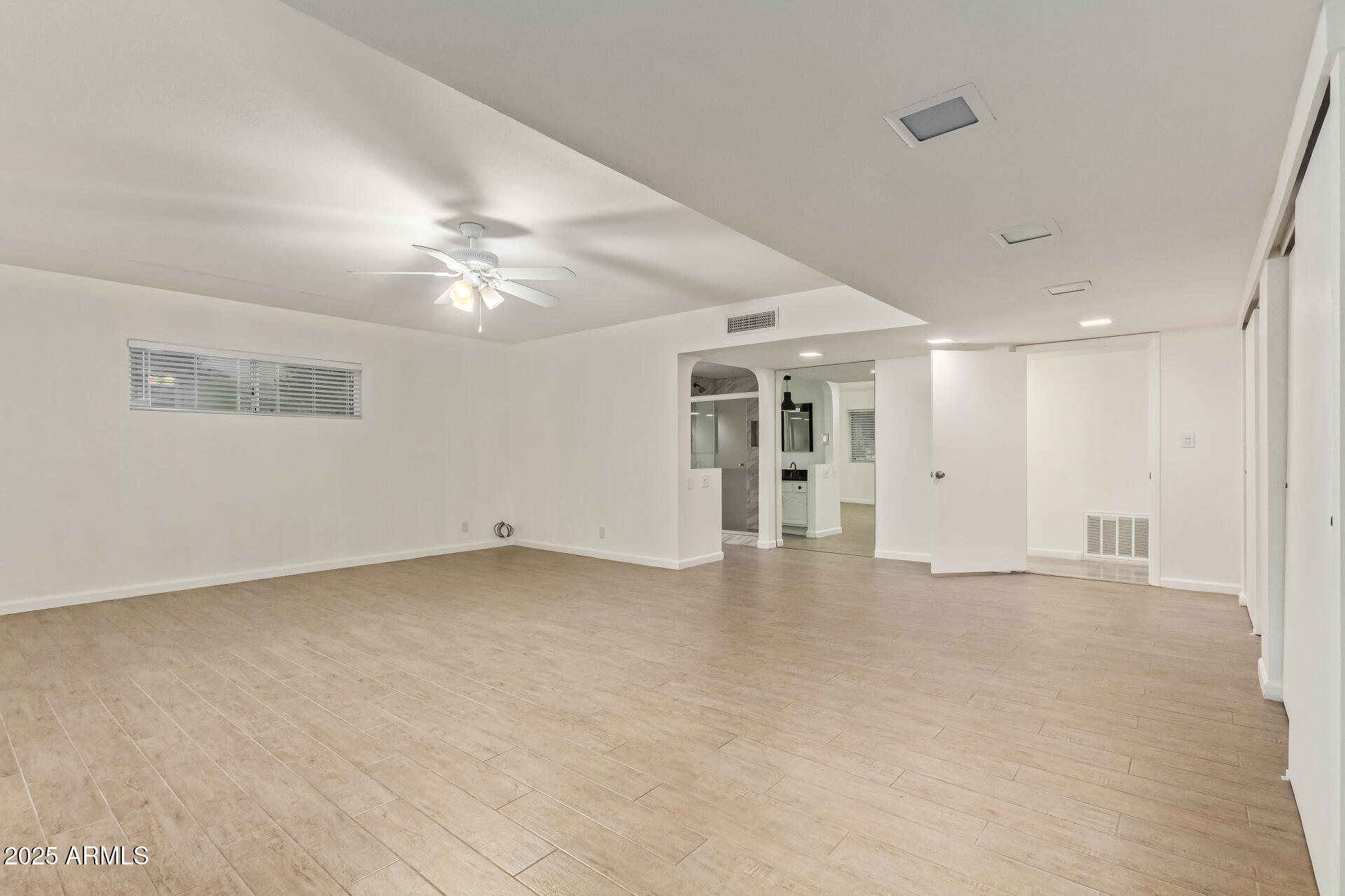 5401 East Exeter Boulevard Phoenix, AZ 85018 - Photo 26 of 47 a view of an empty room with a ceiling fan