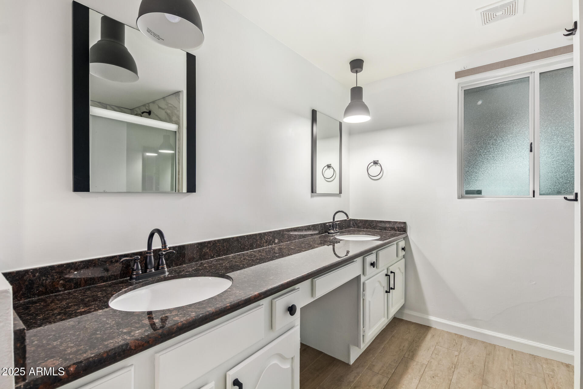 5401 East Exeter Boulevard Phoenix, AZ 85018 - Photo 28 of 47 a bathroom with a granite countertop sink and a mirror