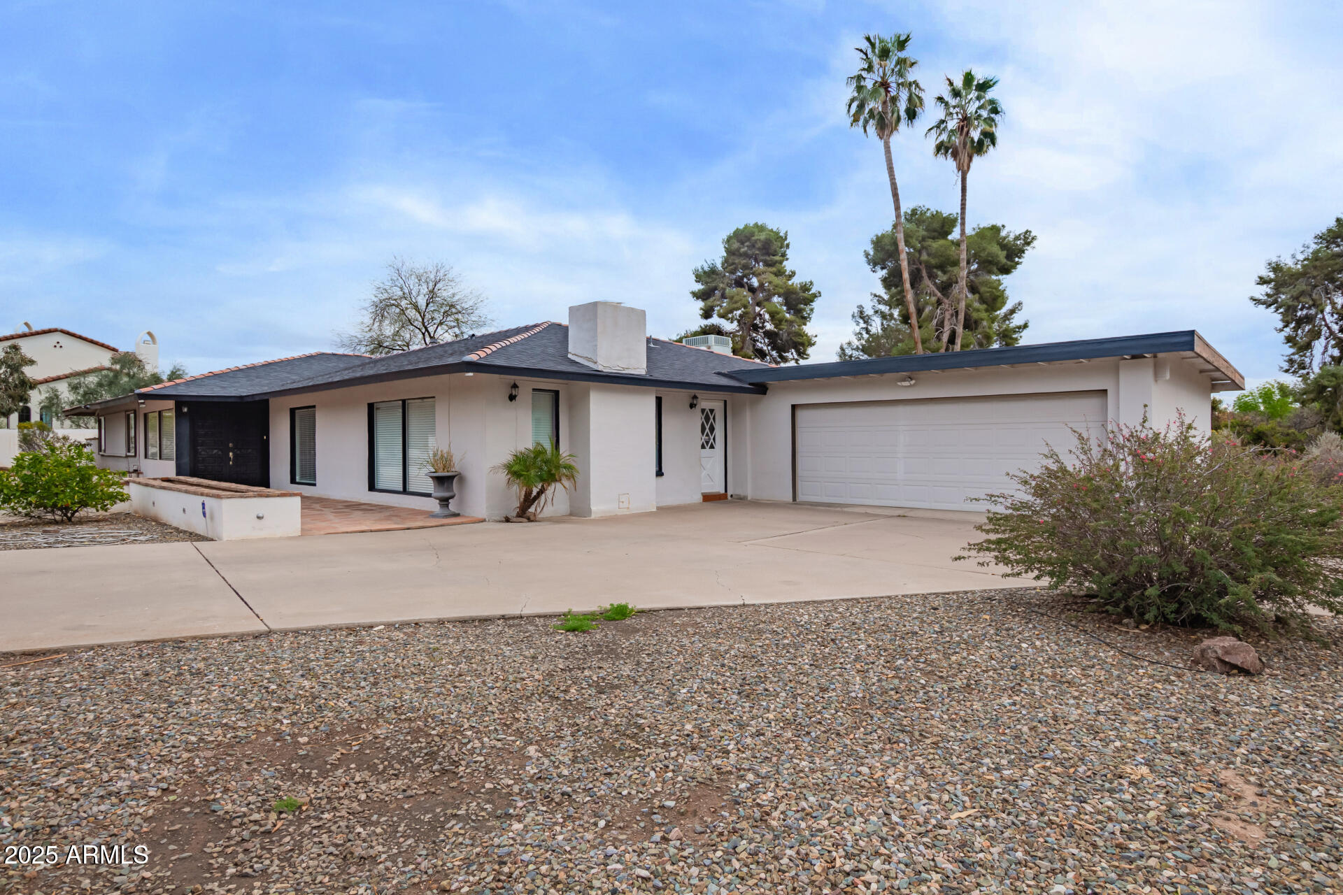 5401 East Exeter Boulevard Phoenix, AZ 85018 - Photo 3 of 47 front view of a house with a yard and a garage