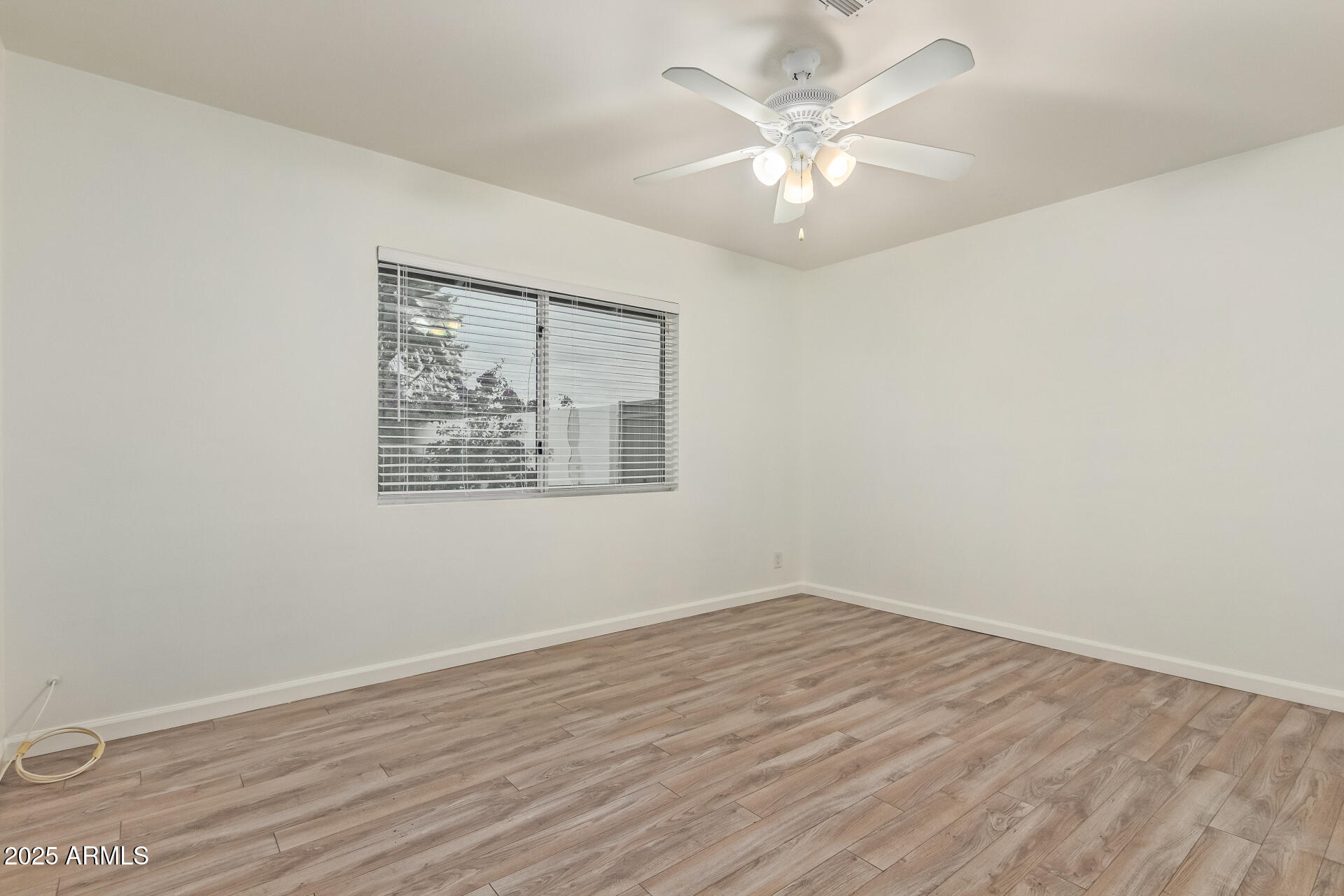 5401 East Exeter Boulevard Phoenix, AZ 85018 - Photo 33 of 47 wooden floor in an empty room with a window