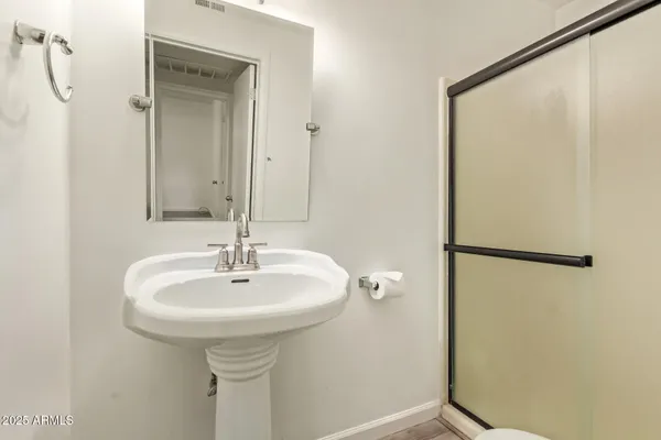 a bathroom with a sink and mirror