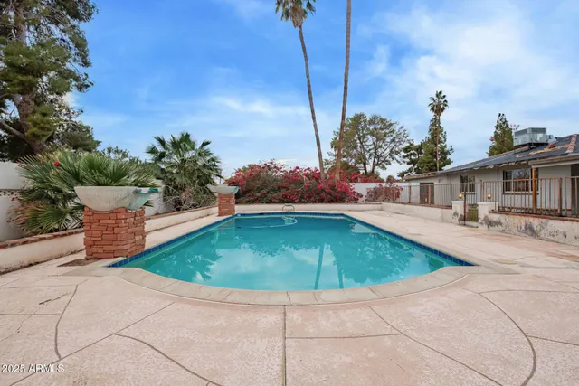 a swimming pool with yard