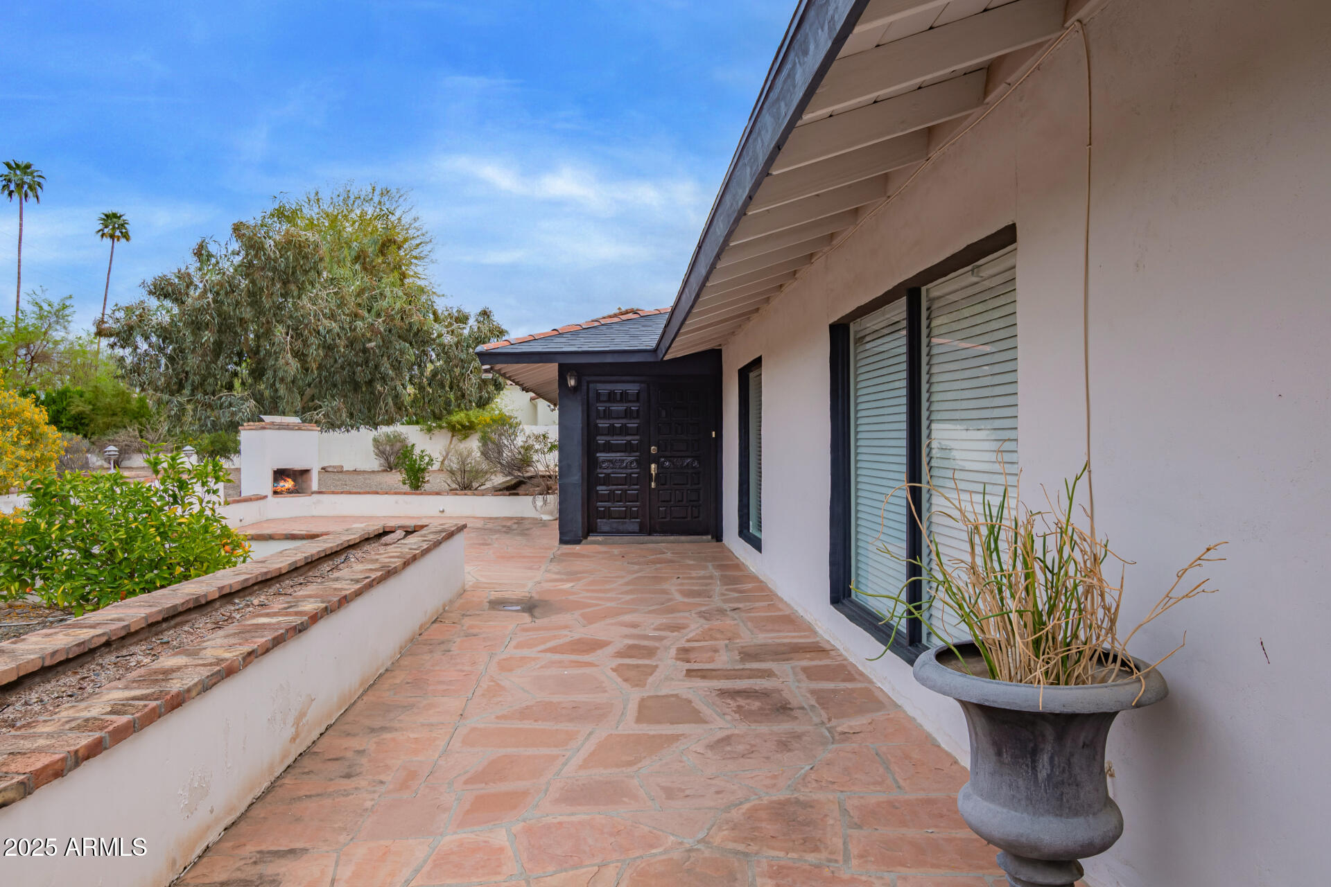 5401 East Exeter Boulevard Phoenix, AZ 85018 - Photo 5 of 47 a front view of a house with a garden