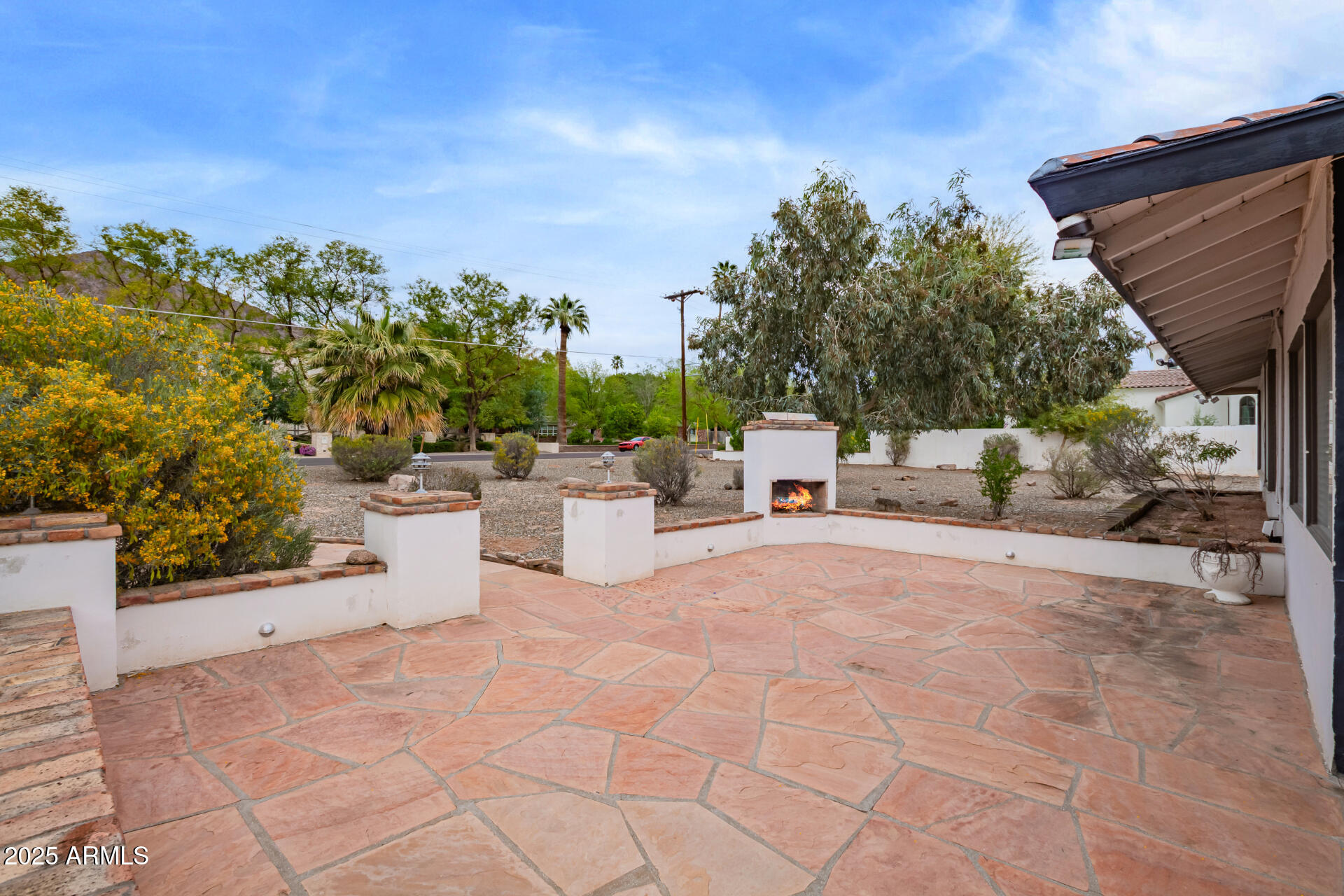 5401 East Exeter Boulevard Phoenix, AZ 85018 - Photo 6 of 47 a view of a terrace with a bench and trees around