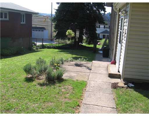 455 Freeport Road Blawnox, PA 15238 - Photo 15 of 18 Patio/Deck. Side patio and yard off family room.