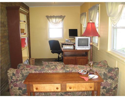 455 Freeport Road Blawnox, PA 15238 - Photo 6 of 18 Family Room. Addition with 5 windows and exit to rear yard.