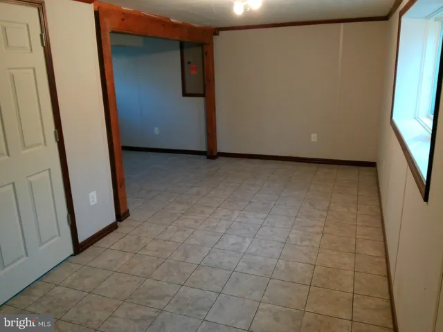 a view of a room with a large window