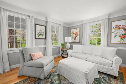 a bed room with a bed and a large window