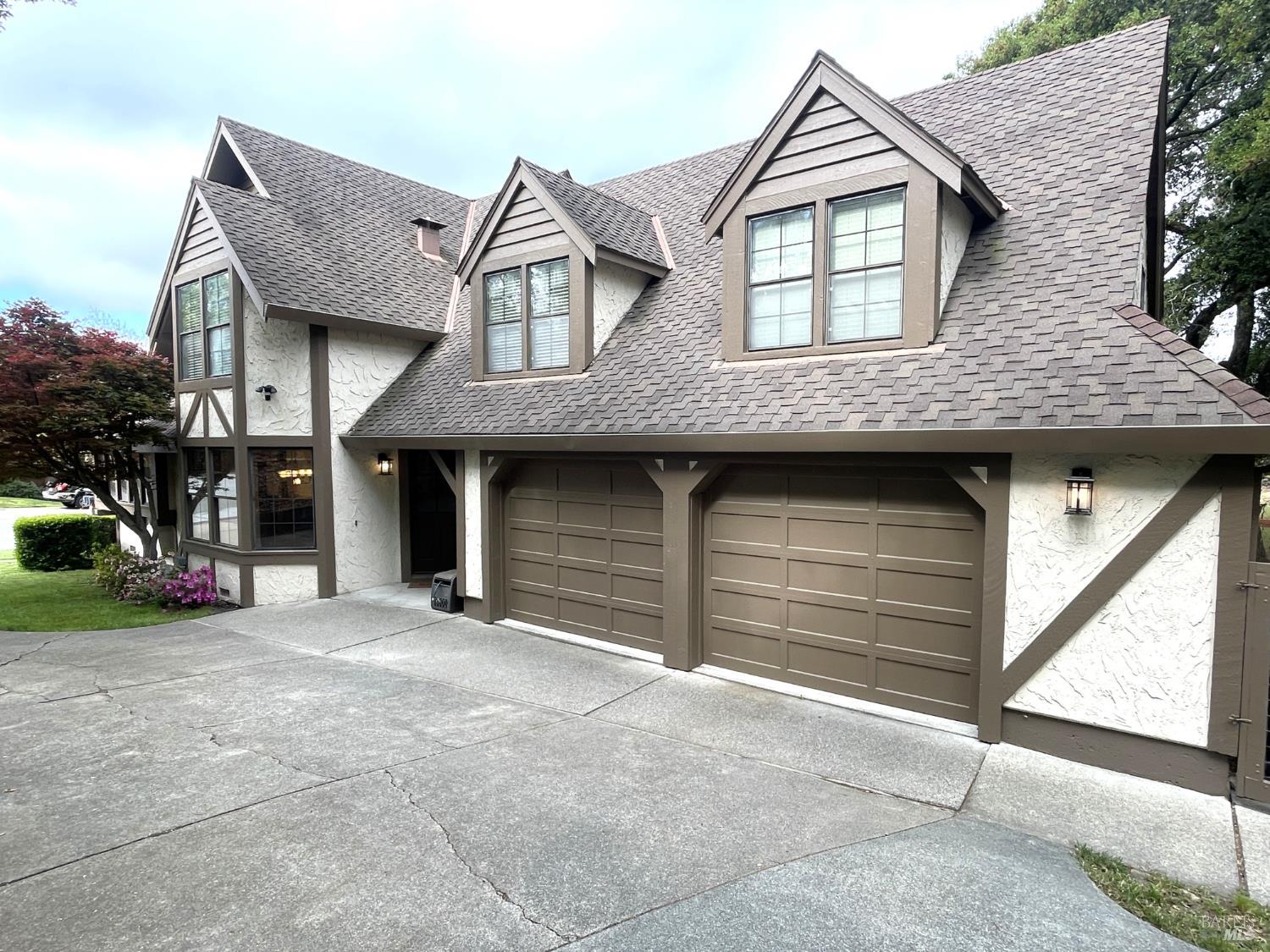 3541 Golf View Terrace Santa Rosa, CA 95405 - Photo 107 of 110 a front view of a house with a yard and garage