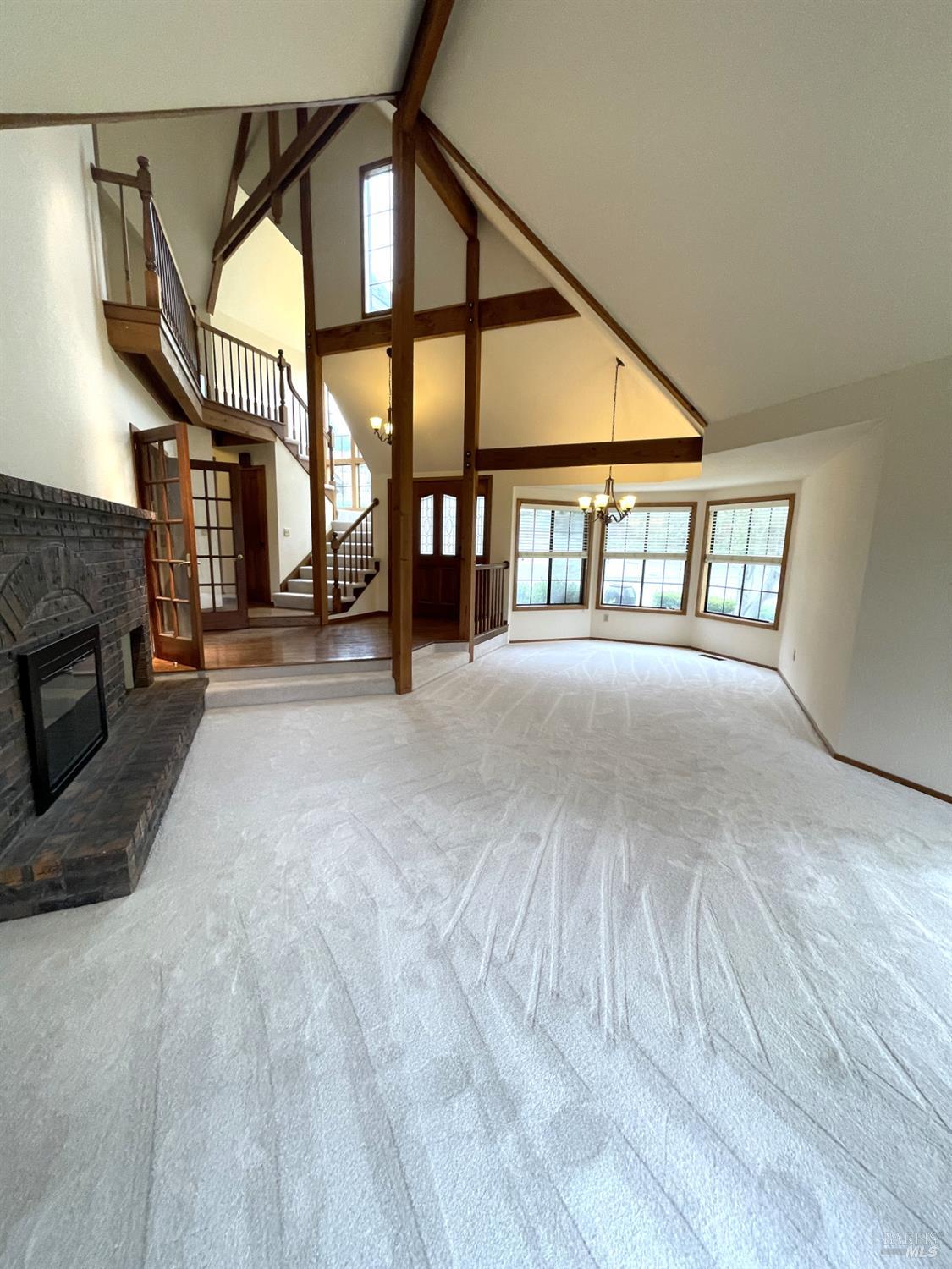 3541 Golf View Terrace Santa Rosa, CA 95405 - Photo 14 of 110 a view of an empty room with a fireplace and windows