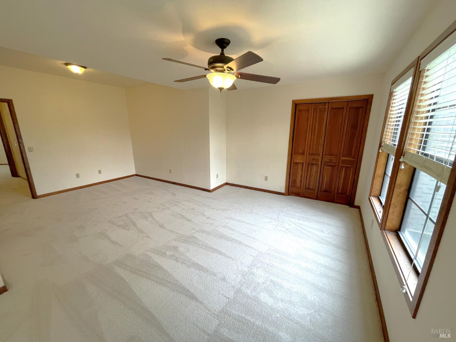 3541 Golf View Terrace Santa Rosa, CA 95405 - Photo 36 of 110 a view of empty room with wooden floor and fan