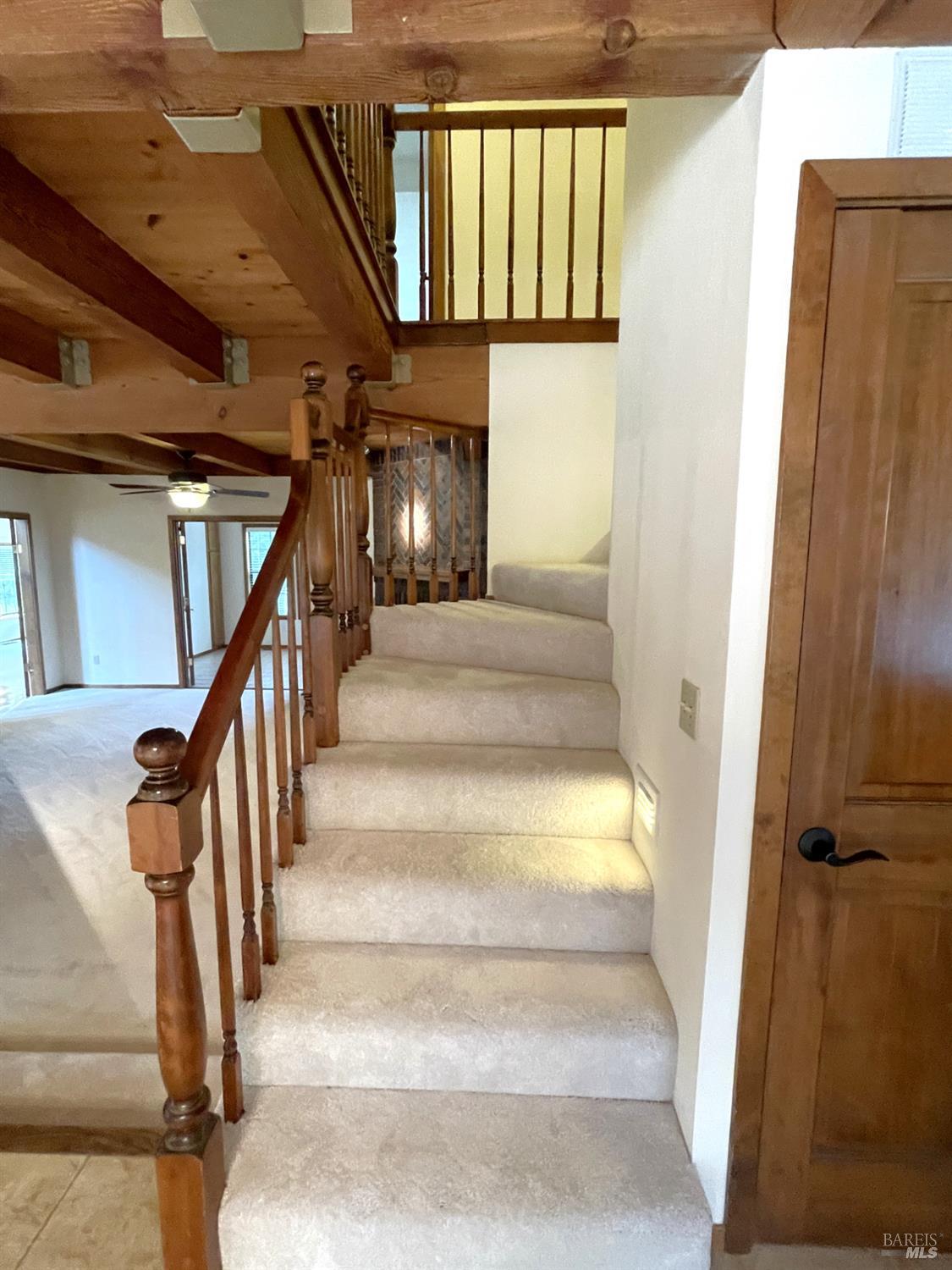 3541 Golf View Terrace Santa Rosa, CA 95405 - Photo 71 of 110 a view of staircase with lots of frames on wall and a window