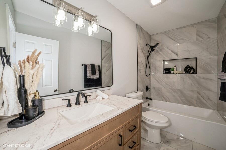 1132 Cleveland Street Hammond, IN 46320 - Photo 15 of 30 a bathroom with a granite countertop sink a toilet and shower