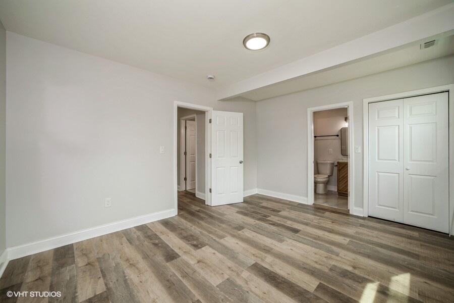 1132 Cleveland Street Hammond, IN 46320 - Photo 24 of 30 a view of an empty room with wooden floor and closet